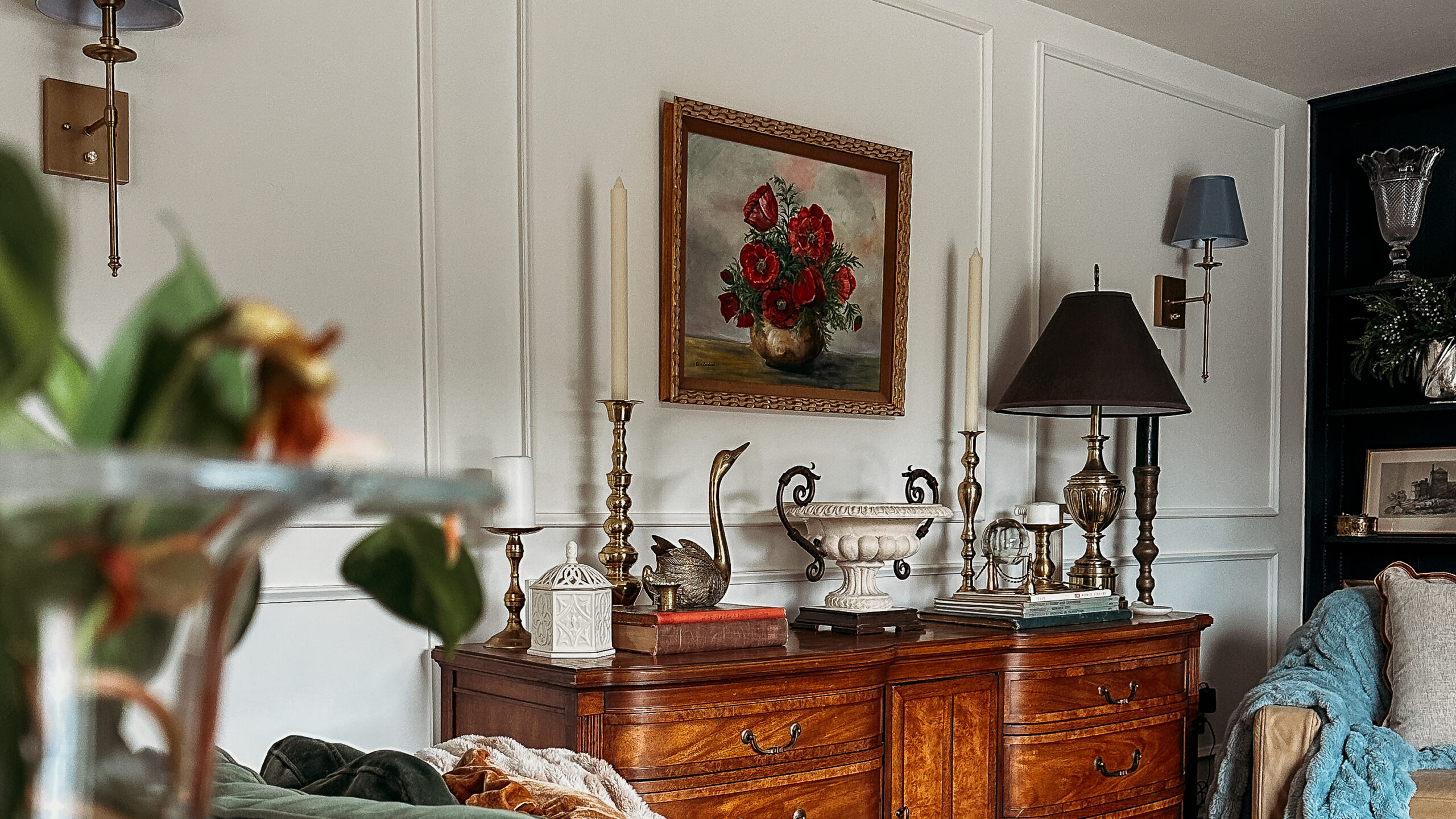 vintage dresser with thrifted home decor and a painting of red poppies