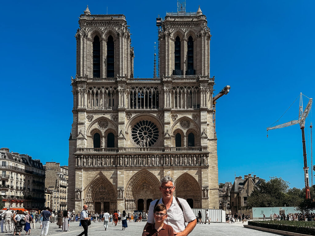 Father and son with Notre Dame in the background.