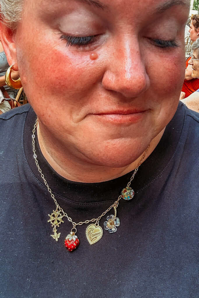 the woman is proud to make the necklace