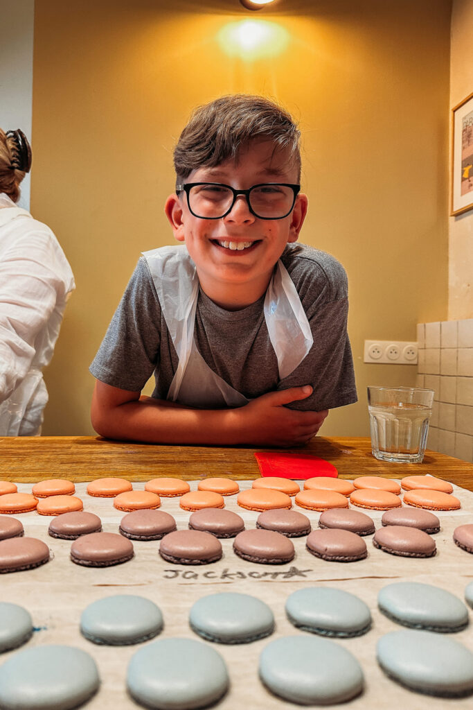 the boy is happy with his macarons