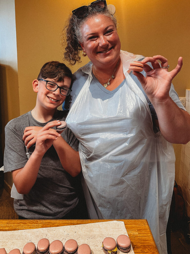 mother and son is happy while holding their made macaron