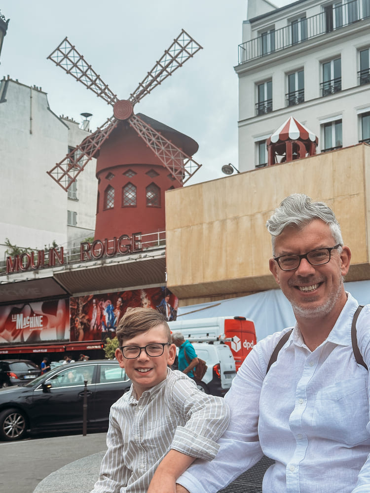picture of father and son in small town/neighborhood of Montmartre